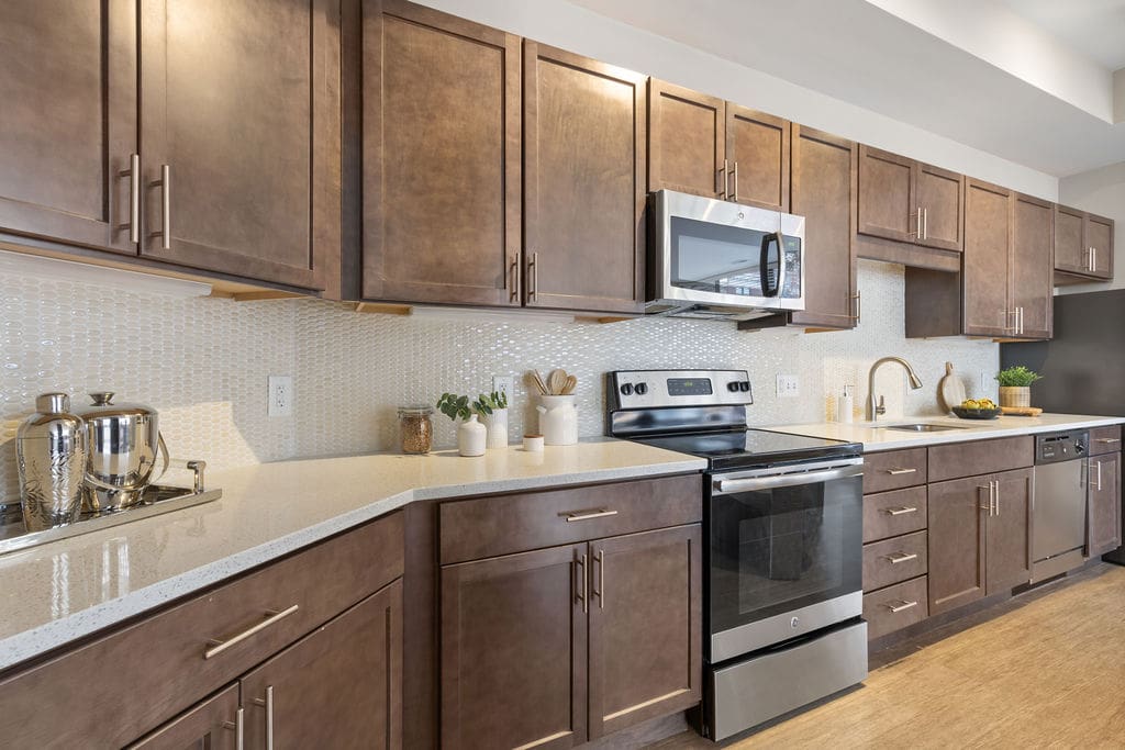 Modern kitchen with stainless appliances and brown cabinets