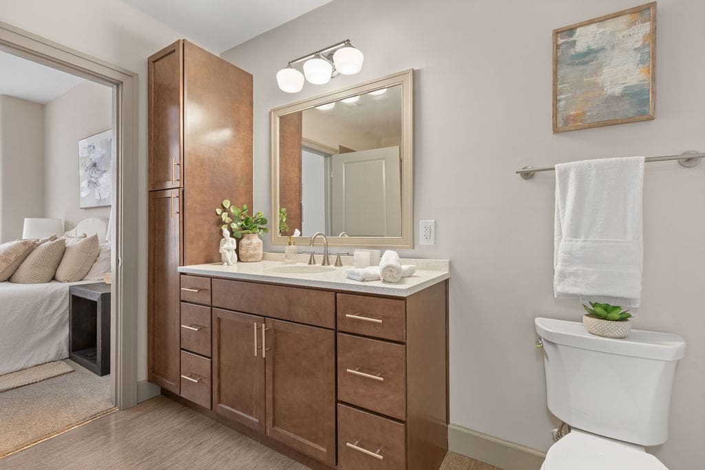 Modern bathroom with wooden vanity and mirror