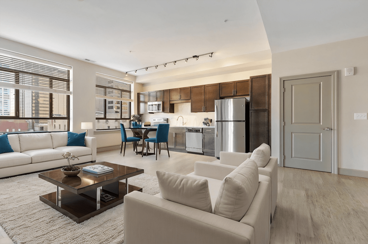 Sunlit living room with blue dining chairs