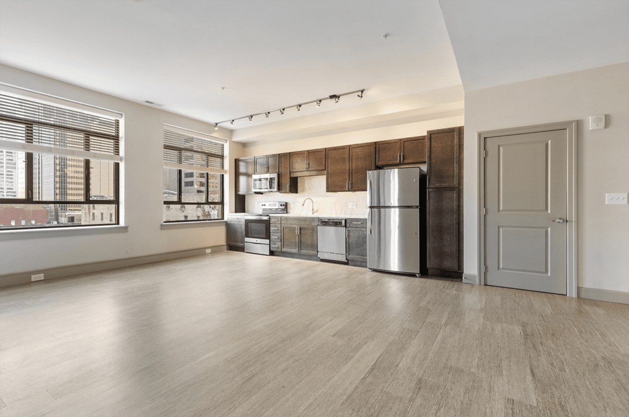 Empty modern kitchen with city windows