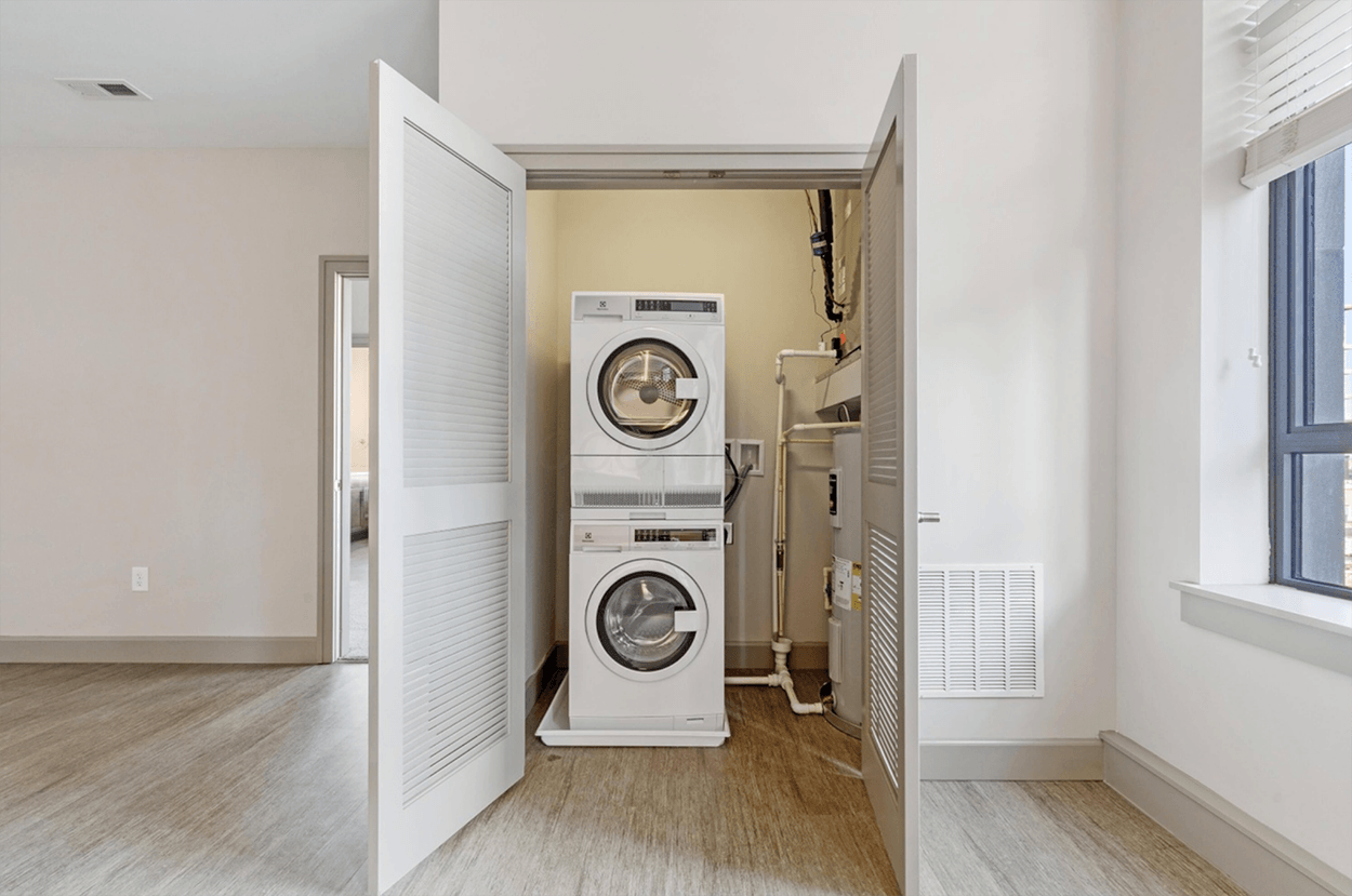 Stacked washer and dryer in closet