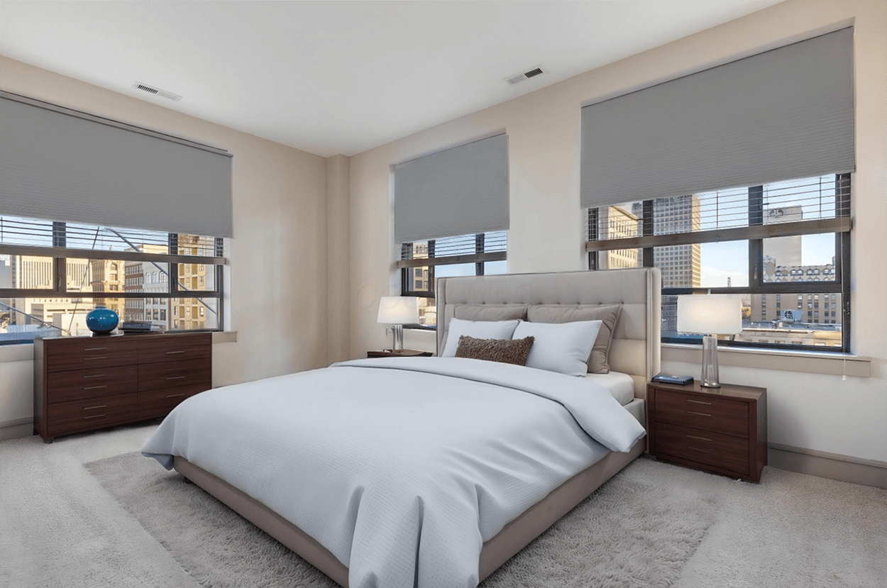 Modern bedroom with city-view windows